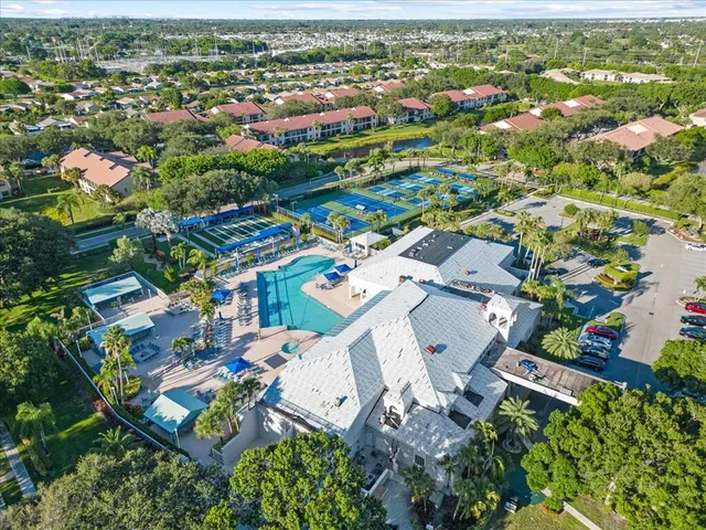 an aerial view of houses with yard