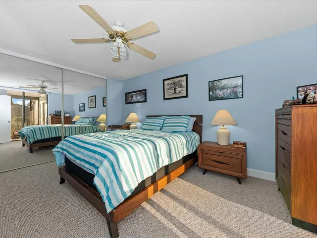 a bedroom with bed and window