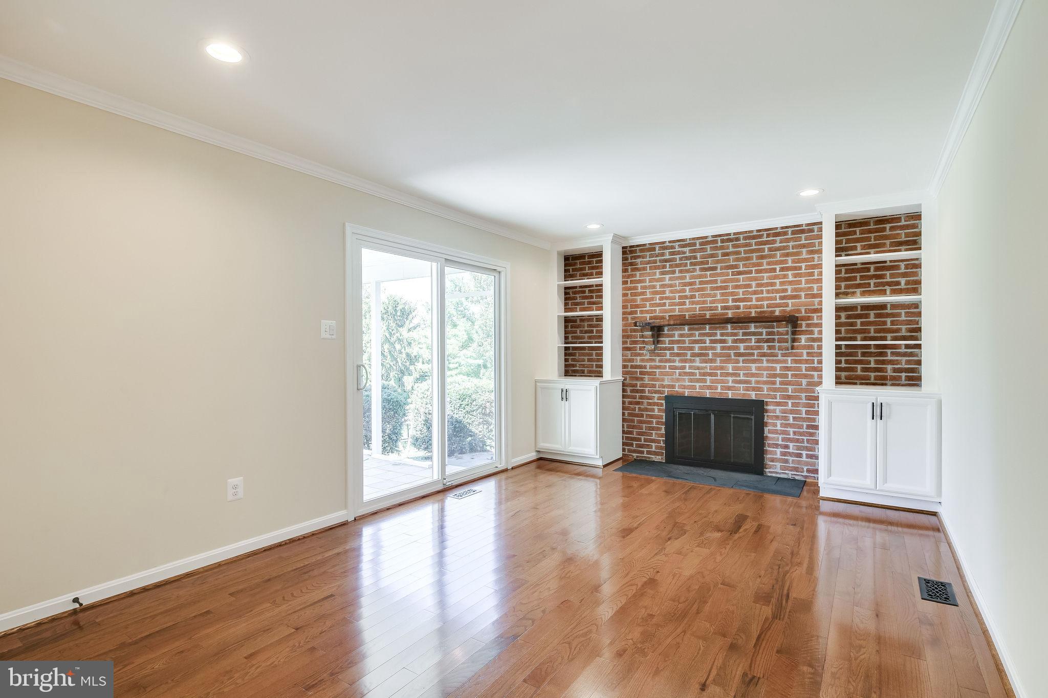 194 Bell Road Westminster, MD 21158 - Photo 13 of 33 Den with Fireplace, Book Shelves & Slider to Porch