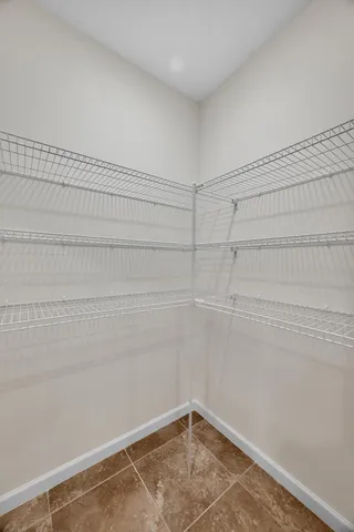 a view of a kitchen with a sink and a stove top oven