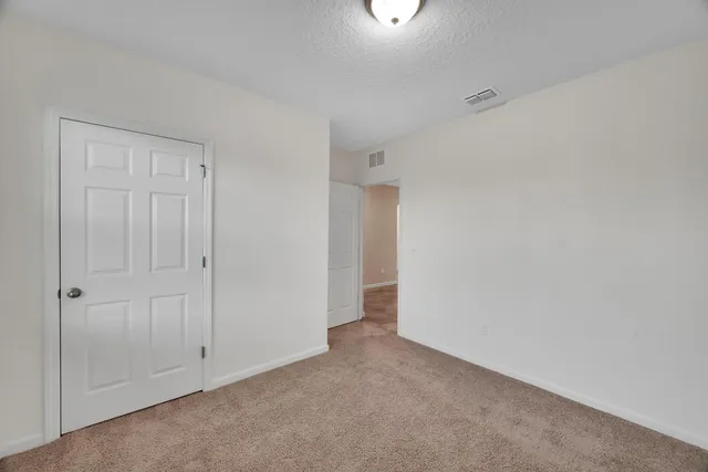 a bathroom with a granite countertop sink a toilet and a bathtub