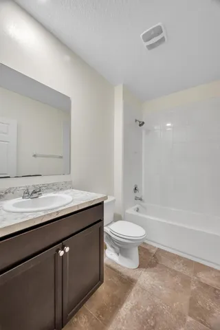 an empty room with a empty space and windows