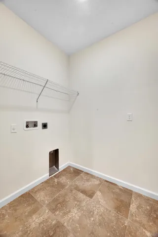 a kitchen with a sink a counter top space stainless steel appliances cabinets and a wooden floor