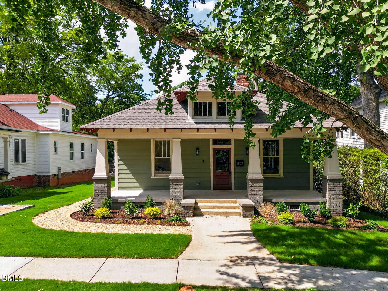 504 Tilden Street Raleigh, NC 27605 - Photo 50 of 58 a front view of a house with garden