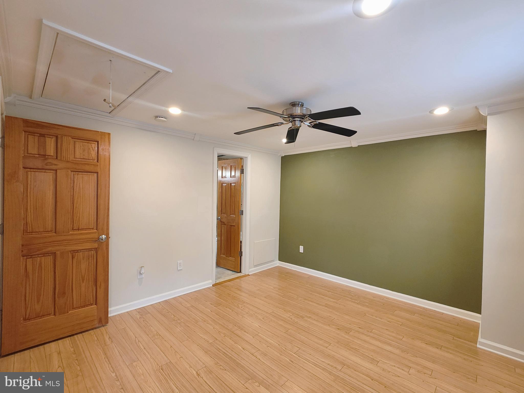 9533 Quarry Bridge Court Columbia, MD 21046 - Photo 11 of 17 a view of an empty room with wooden floor