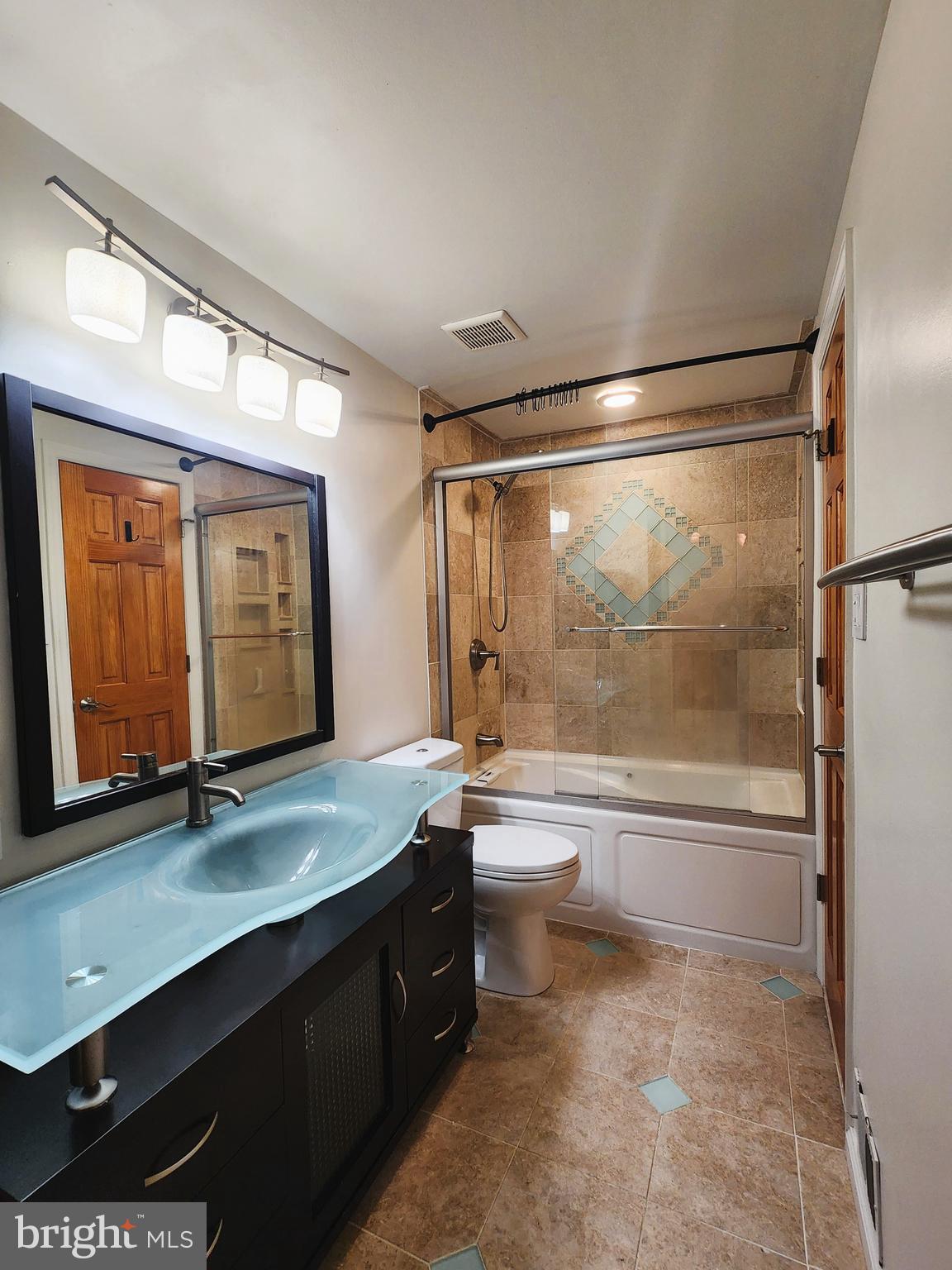 9533 Quarry Bridge Court Columbia, MD 21046 - Photo 13 of 17 a bathroom with a granite countertop sink mirror bathtub and toilet