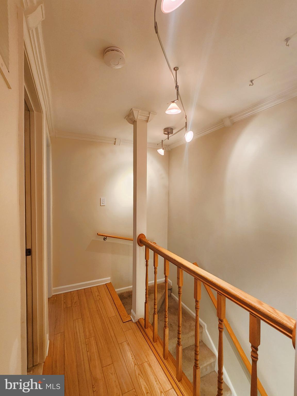 9533 Quarry Bridge Court Columbia, MD 21046 - Photo 17 of 17 a view of a hallway with wooden floor