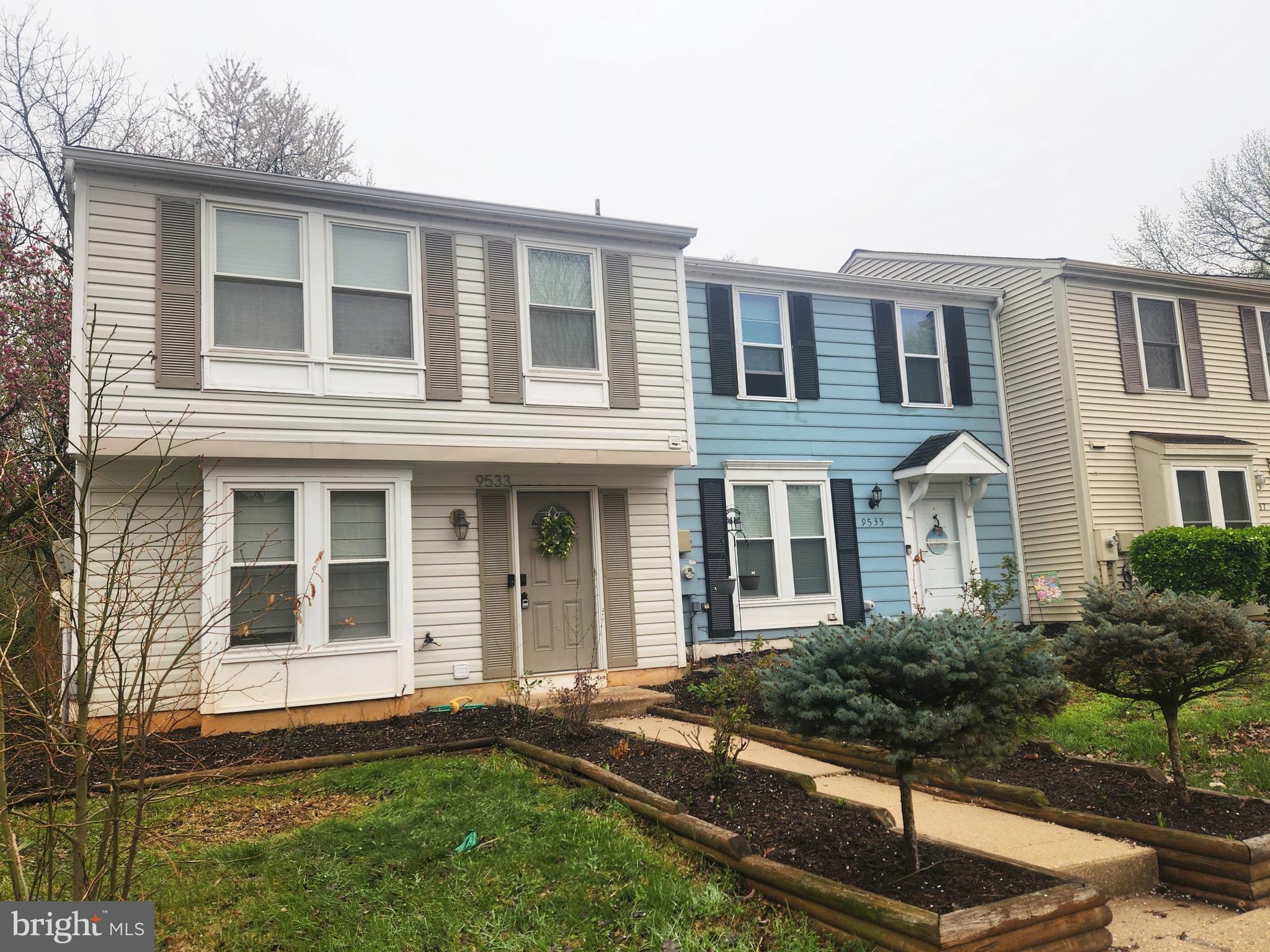 9533 Quarry Bridge Court Columbia, MD 21046 - Photo 2 of 17 front view of a house with a yard