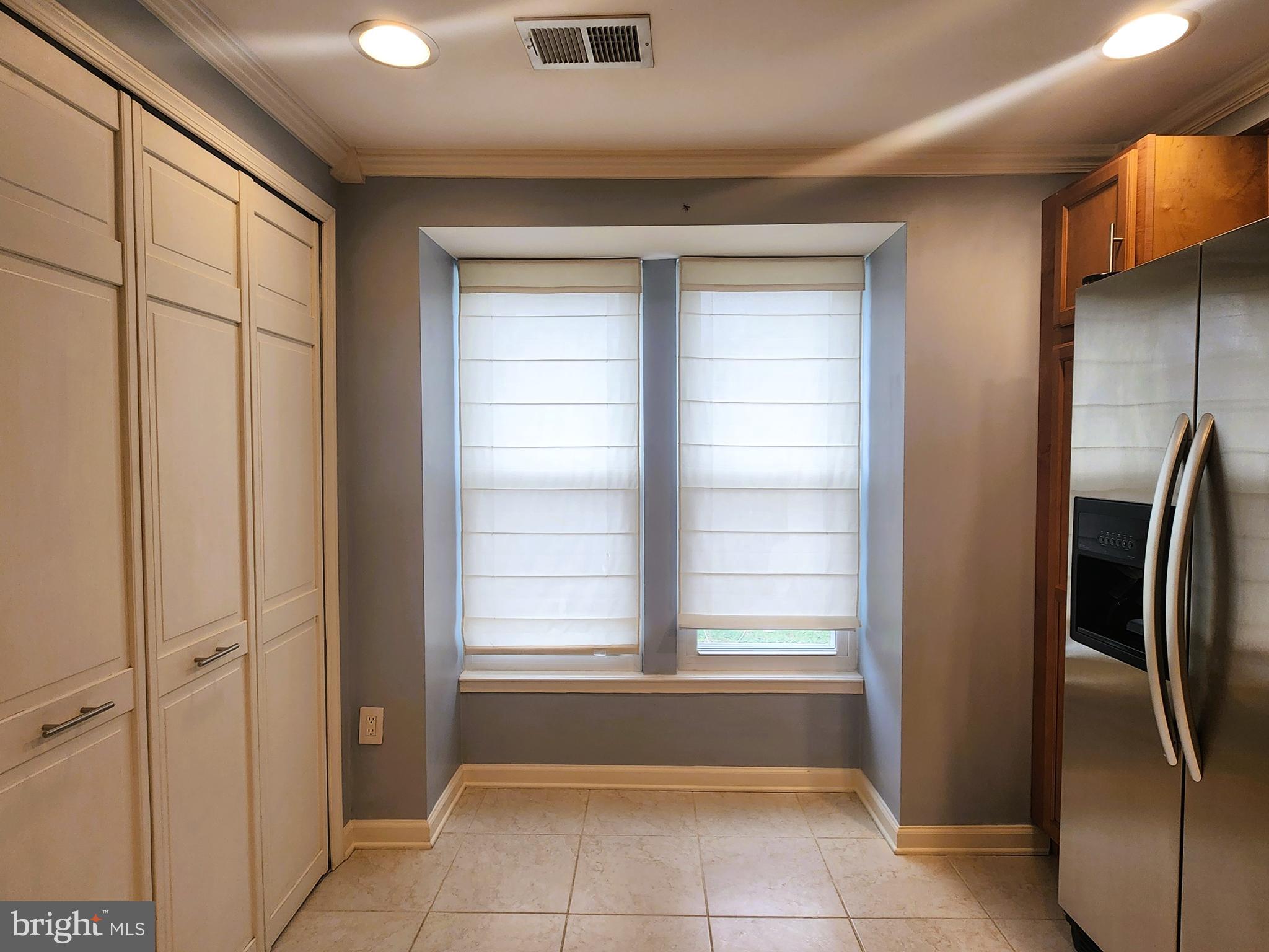 9533 Quarry Bridge Court Columbia, MD 21046 - Photo 5 of 17 a view of an empty room and window