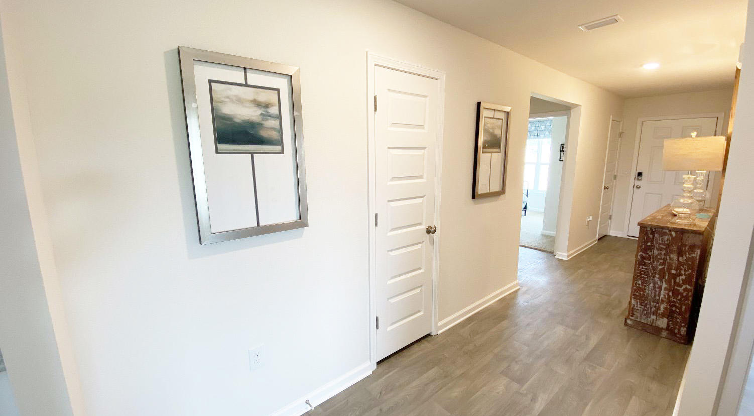 973 Indian Woman Road Santa Rosa Beach, FL 32459 - Photo 11 of 23 a view of hallway with livingroom and wooden floor