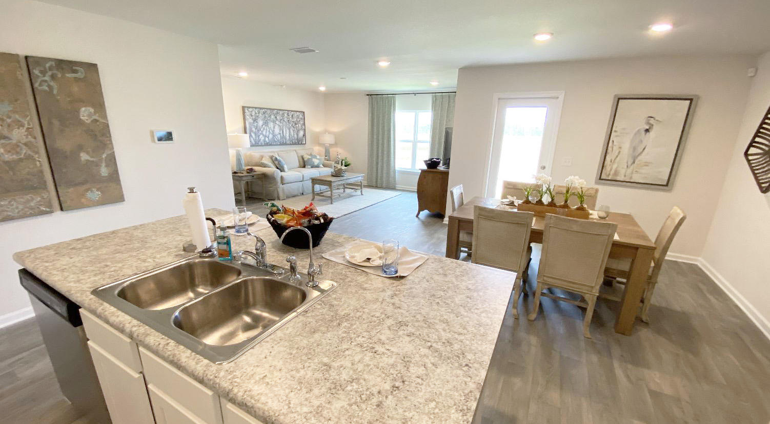 973 Indian Woman Road Santa Rosa Beach, FL 32459 - Photo 13 of 23 a kitchen with a table chairs and a refrigerator