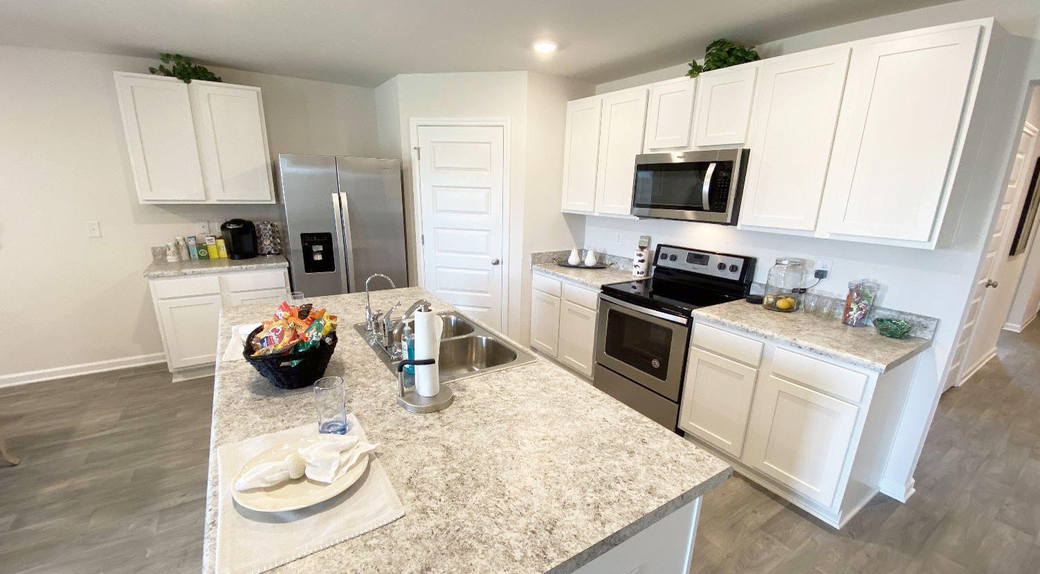 973 Indian Woman Road Santa Rosa Beach, FL 32459 - Photo 15 of 23 a kitchen with sink a microwave and cabinets