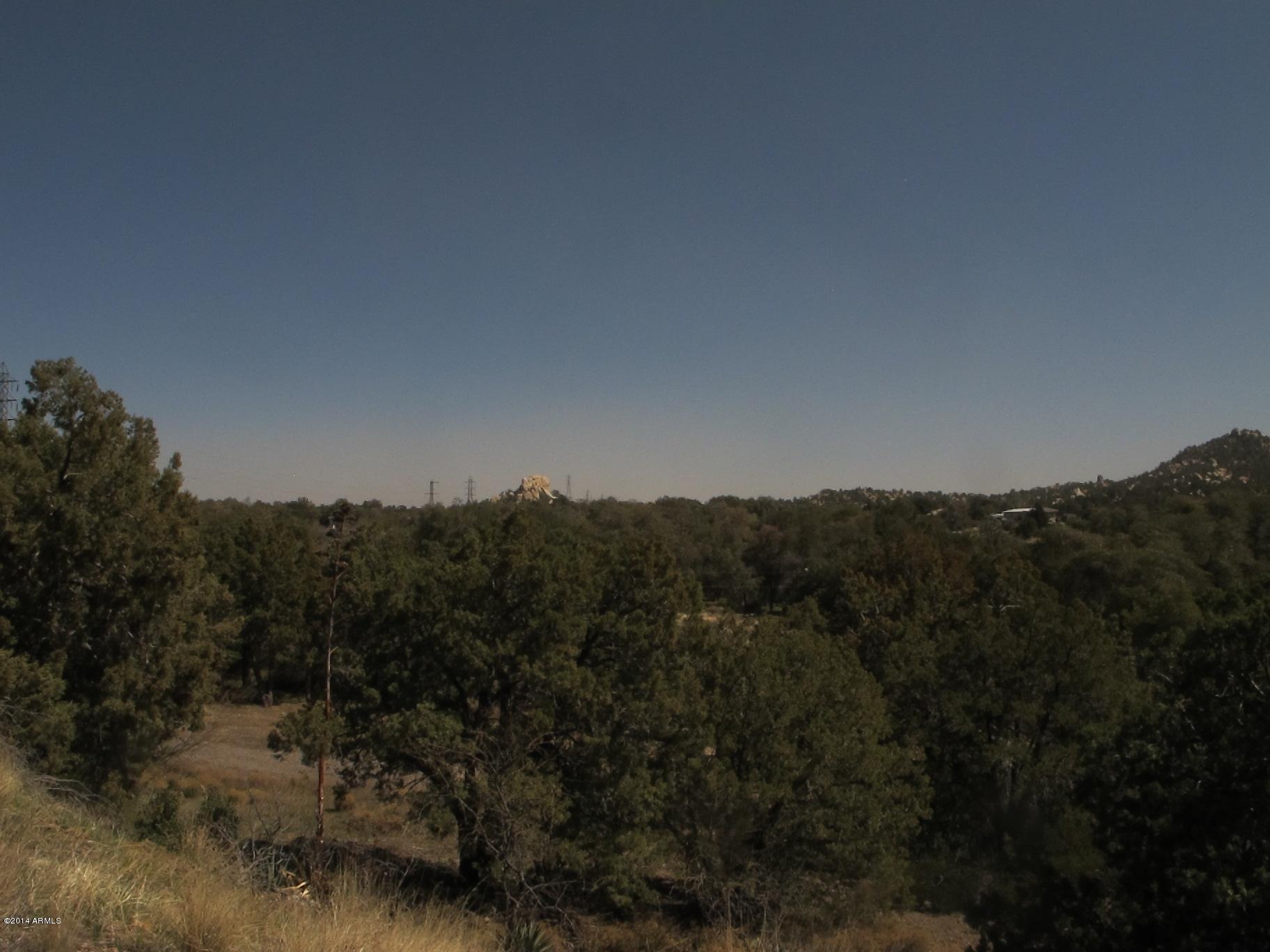 52975 East Harper Road Miami, AZ 85539 - Photo 12 of 31 a view of a house with a mountain and a forest