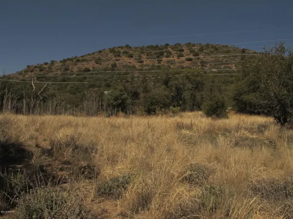 a backyard of a house with a yard and lake view