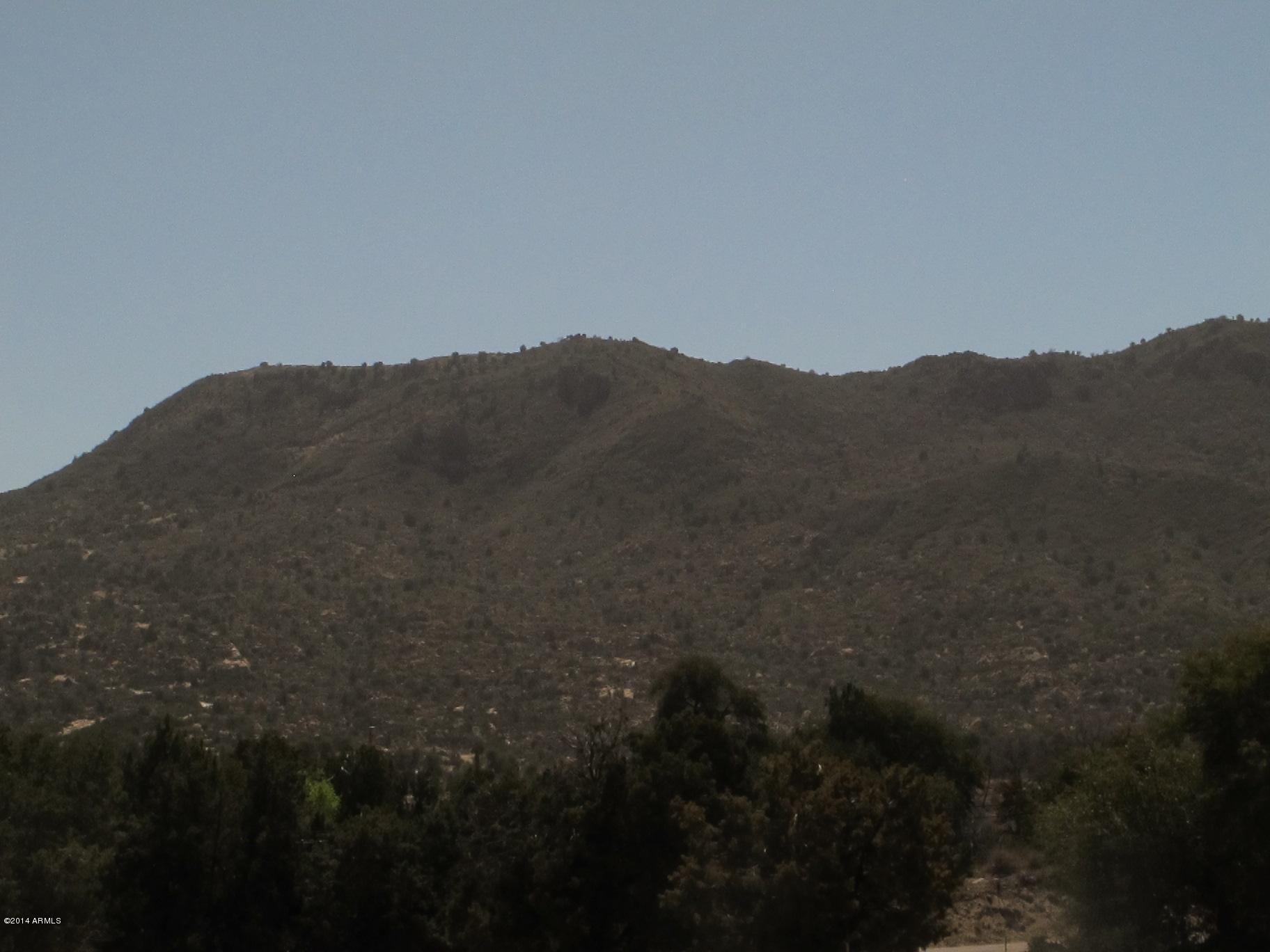 52975 East Harper Road Miami, AZ 85539 - Photo 7 of 31 a view of a house with a mountain