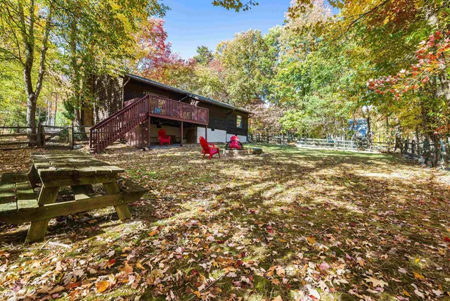 a view of a backyard with a small cabin