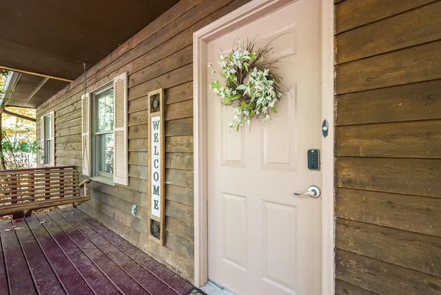 a view of balcony with wooden floor
