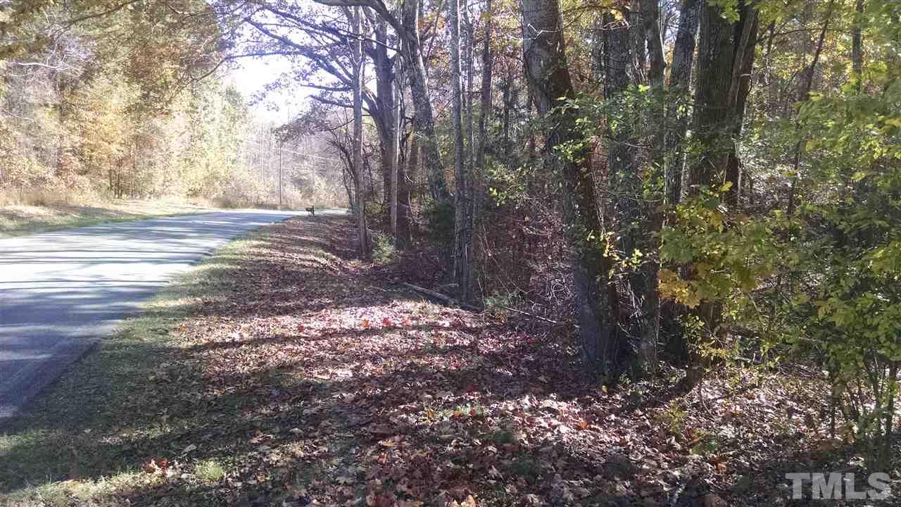 7915 McKee Road, Unit B Rougemont, NC 27572 - Photo 1 of 5 a view of dirt yard with a tree