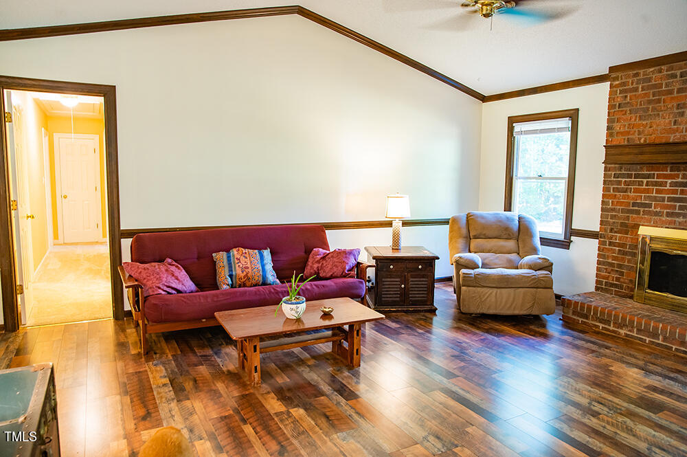 850 Lewis Winstead Lp Road Roxboro, NC 27574 - Photo 11 of 72 a living room with furniture and a wooden floor