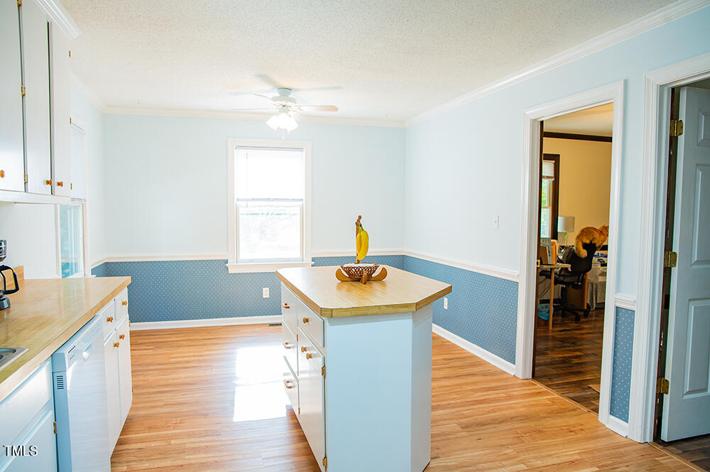 850 Lewis Winstead Lp Road Roxboro, NC 27574 - Photo 17 of 72 a kitchen with a sink cabinets and wooden floor