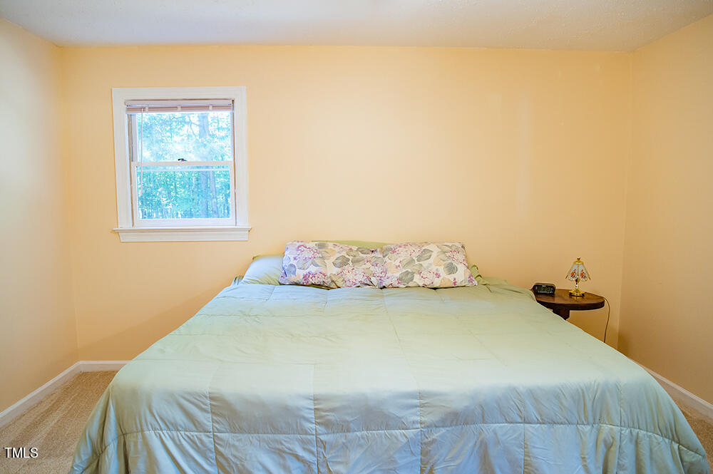 850 Lewis Winstead Lp Road Roxboro, NC 27574 - Photo 29 of 72 a bedroom with a bed and a window