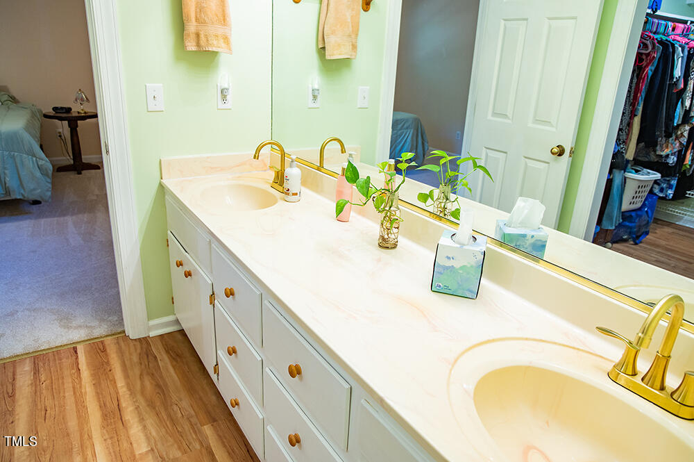 850 Lewis Winstead Lp Road Roxboro, NC 27574 - Photo 33 of 72 a bathroom with a granite countertop sink and a mirror