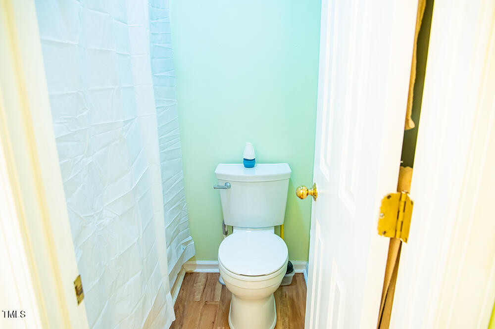 850 Lewis Winstead Lp Road Roxboro, NC 27574 - Photo 34 of 72 a white toilet sitting next to a white sink