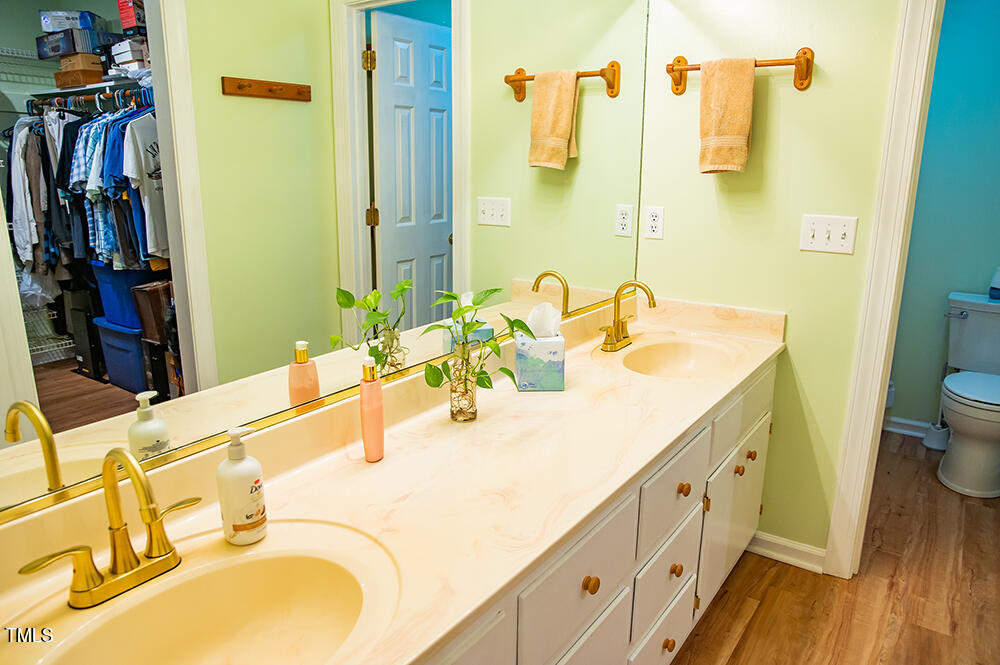 850 Lewis Winstead Lp Road Roxboro, NC 27574 - Photo 35 of 72 a bathroom with a granite countertop sink and a mirror