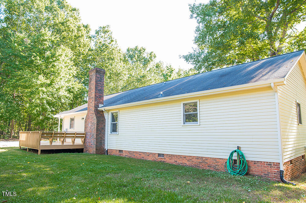 850 Lewis Winstead Lp Road Roxboro, NC 27574 - Photo 52 of 72 a view of a backyard with plants and a garden