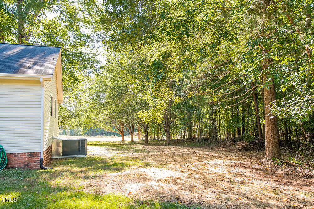 850 Lewis Winstead Lp Road Roxboro, NC 27574 - Photo 59 of 72 a view of a yard with a tree