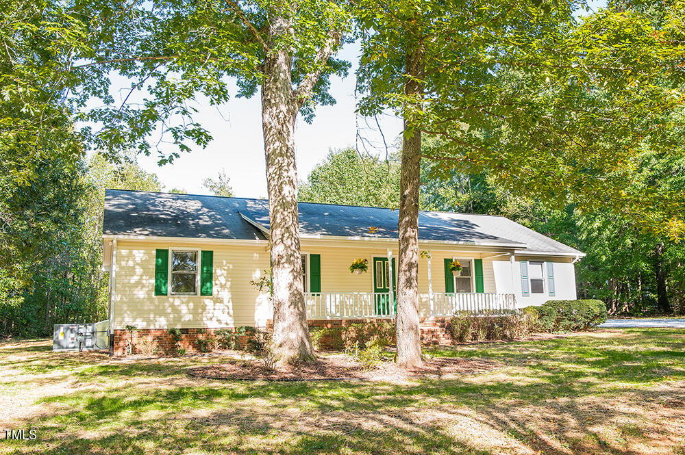 850 Lewis Winstead Lp Road Roxboro, NC 27574 - Photo 60 of 72 a front view of a house with a garden