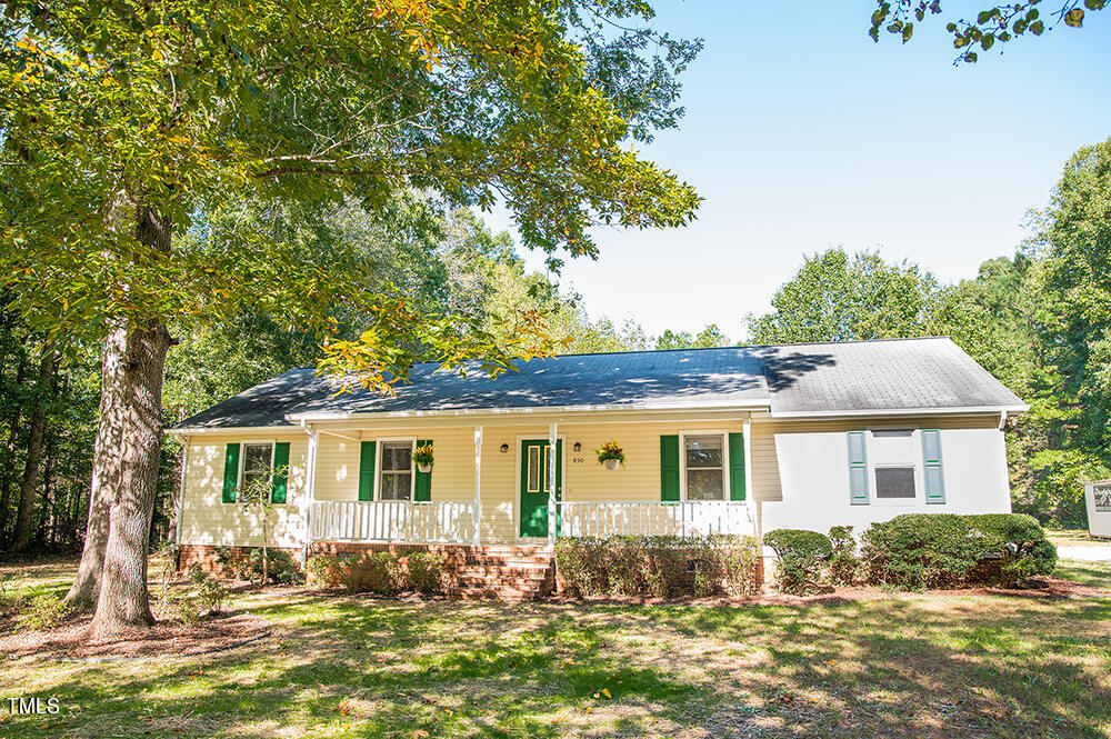 850 Lewis Winstead Lp Road Roxboro, NC 27574 - Photo 61 of 72 a front view of a house with a yard