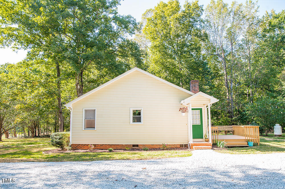 850 Lewis Winstead Lp Road Roxboro, NC 27574 - Photo 63 of 72 a view of a house with backyard and trees