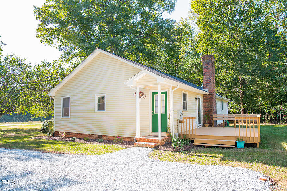 850 Lewis Winstead Lp Road Roxboro, NC 27574 - Photo 64 of 72 a view of a house with a yard and sitting area