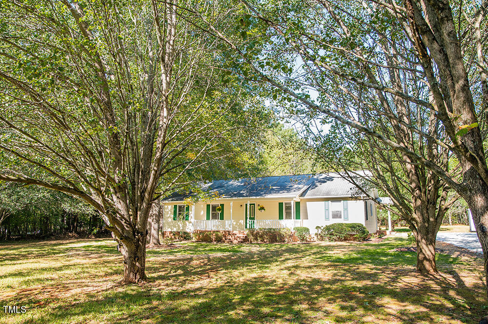 850 Lewis Winstead Lp Road Roxboro, NC 27574 - Photo 66 of 72 a front view of a house with a garden