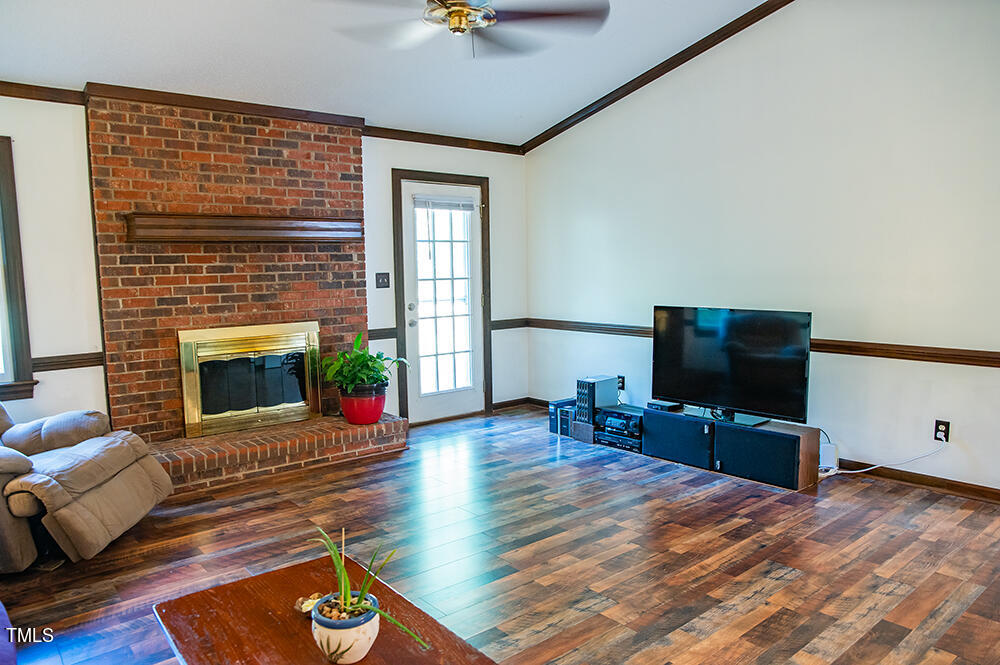 850 Lewis Winstead Lp Road Roxboro, NC 27574 - Photo 9 of 72 a living room with furniture flat screen tv and a fireplace