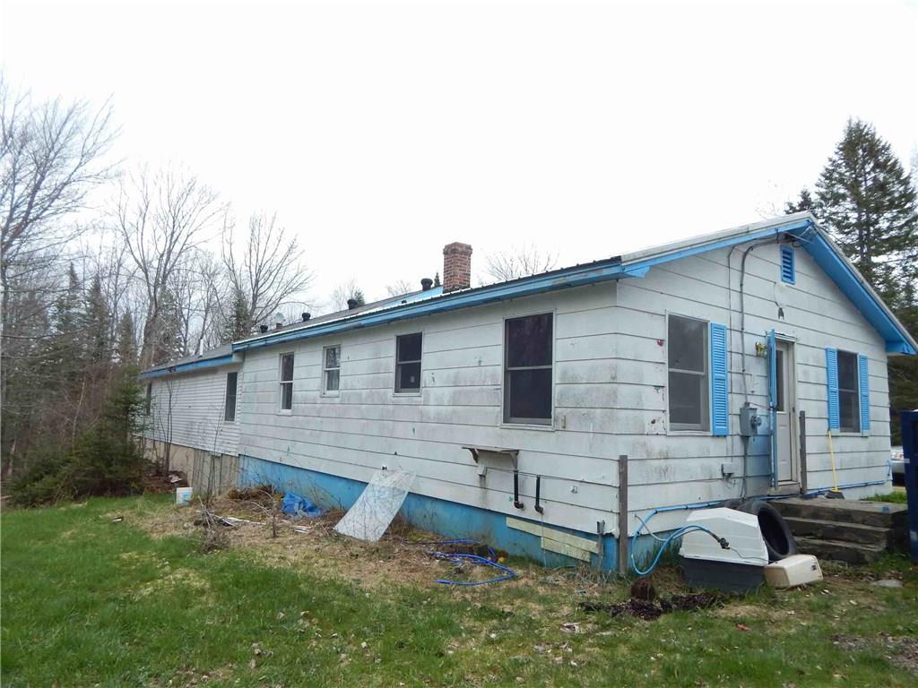 153 Woodland Road Princeton, ME 04668 - Photo 5 of 20 Rear and left side of Ranch home