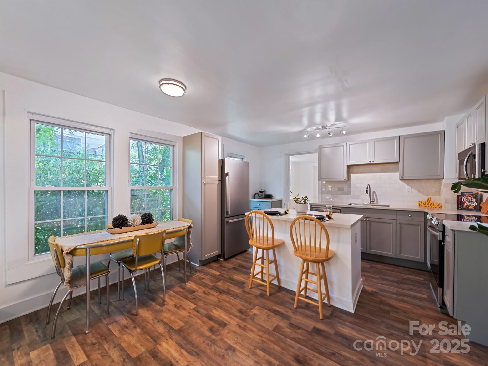 468 Deaverview Road Asheville, NC 28806 - Photo 11 of 26 a room with furniture a dining table and a window
