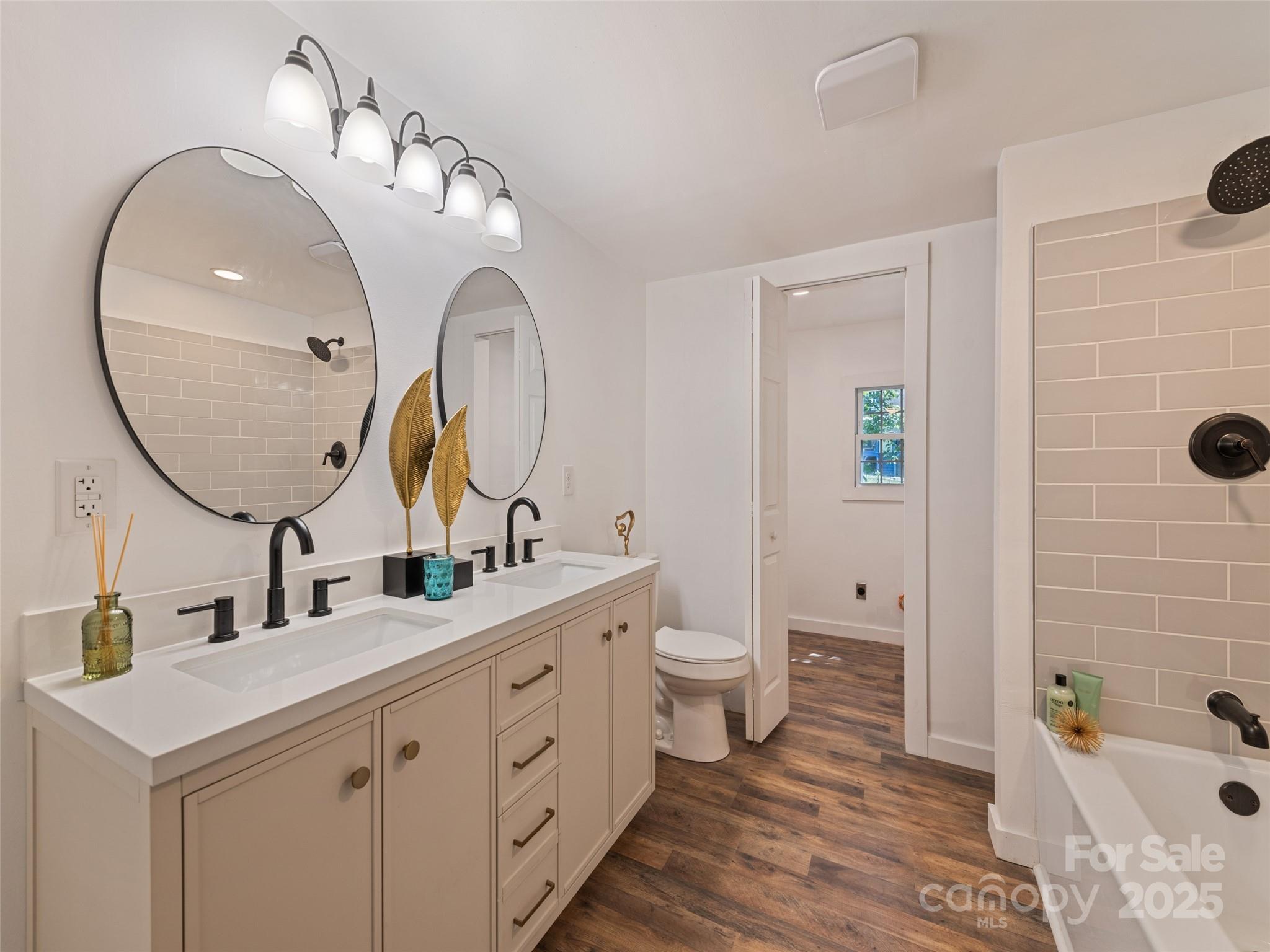 468 Deaverview Road Asheville, NC 28806 - Photo 18 of 26 a bathroom with a sink mirror and toilet