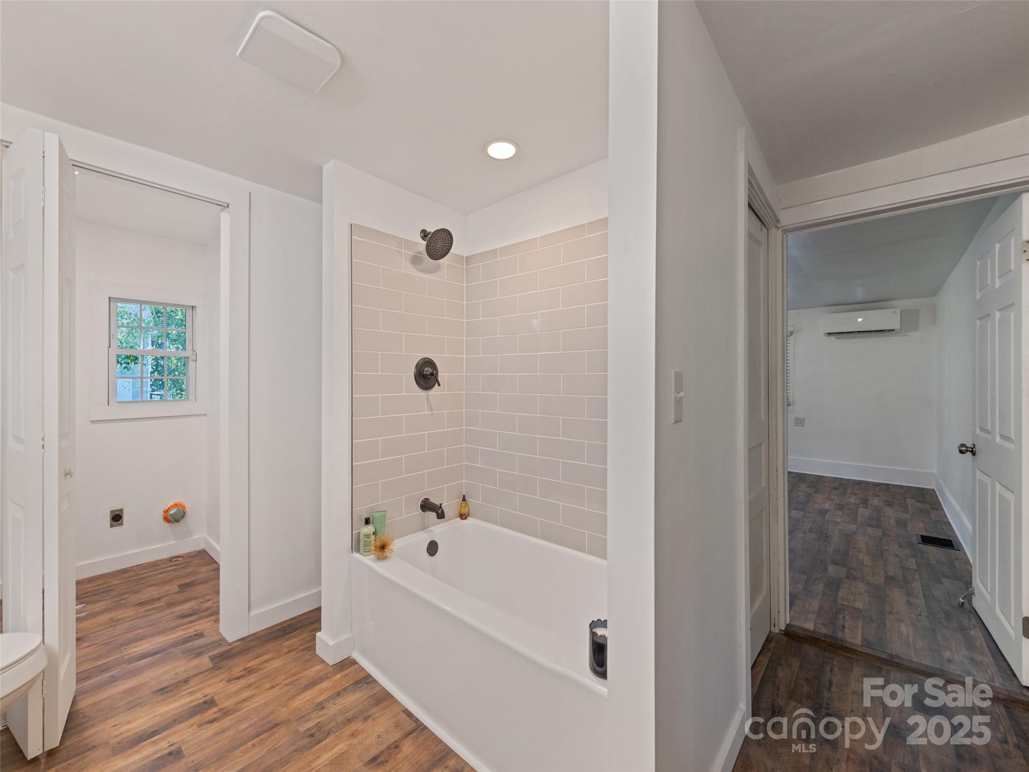 468 Deaverview Road Asheville, NC 28806 - Photo 19 of 26 a bathroom with a bathtub and a shower