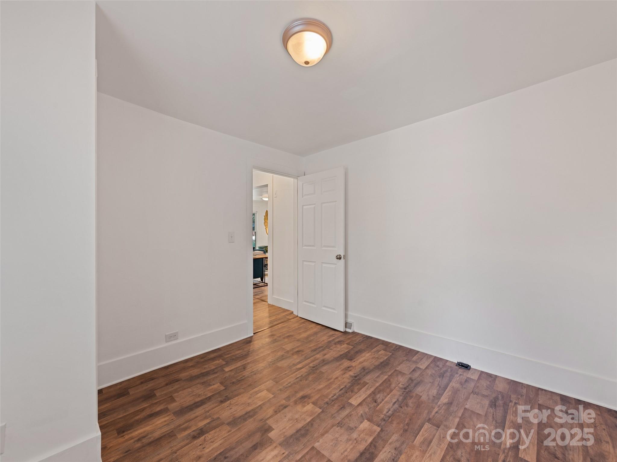 468 Deaverview Road Asheville, NC 28806 - Photo 22 of 26 a view of empty room with wooden floor