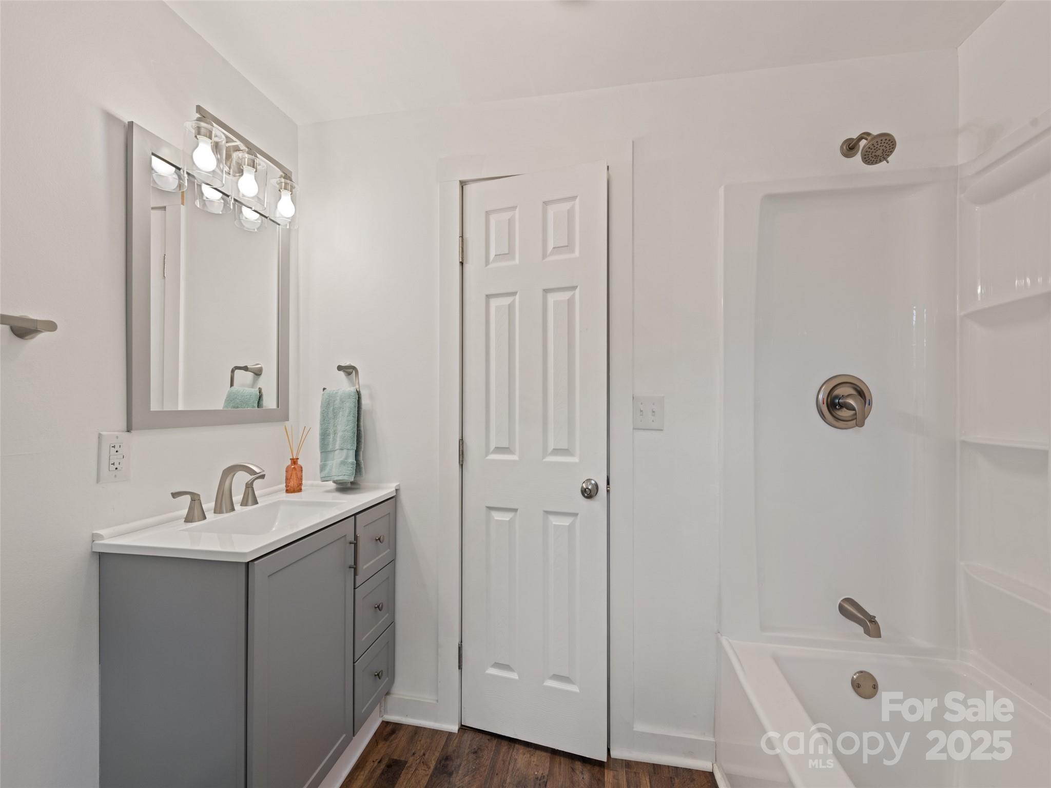 468 Deaverview Road Asheville, NC 28806 - Photo 23 of 26 a bathroom with a sink a tub and a mirror