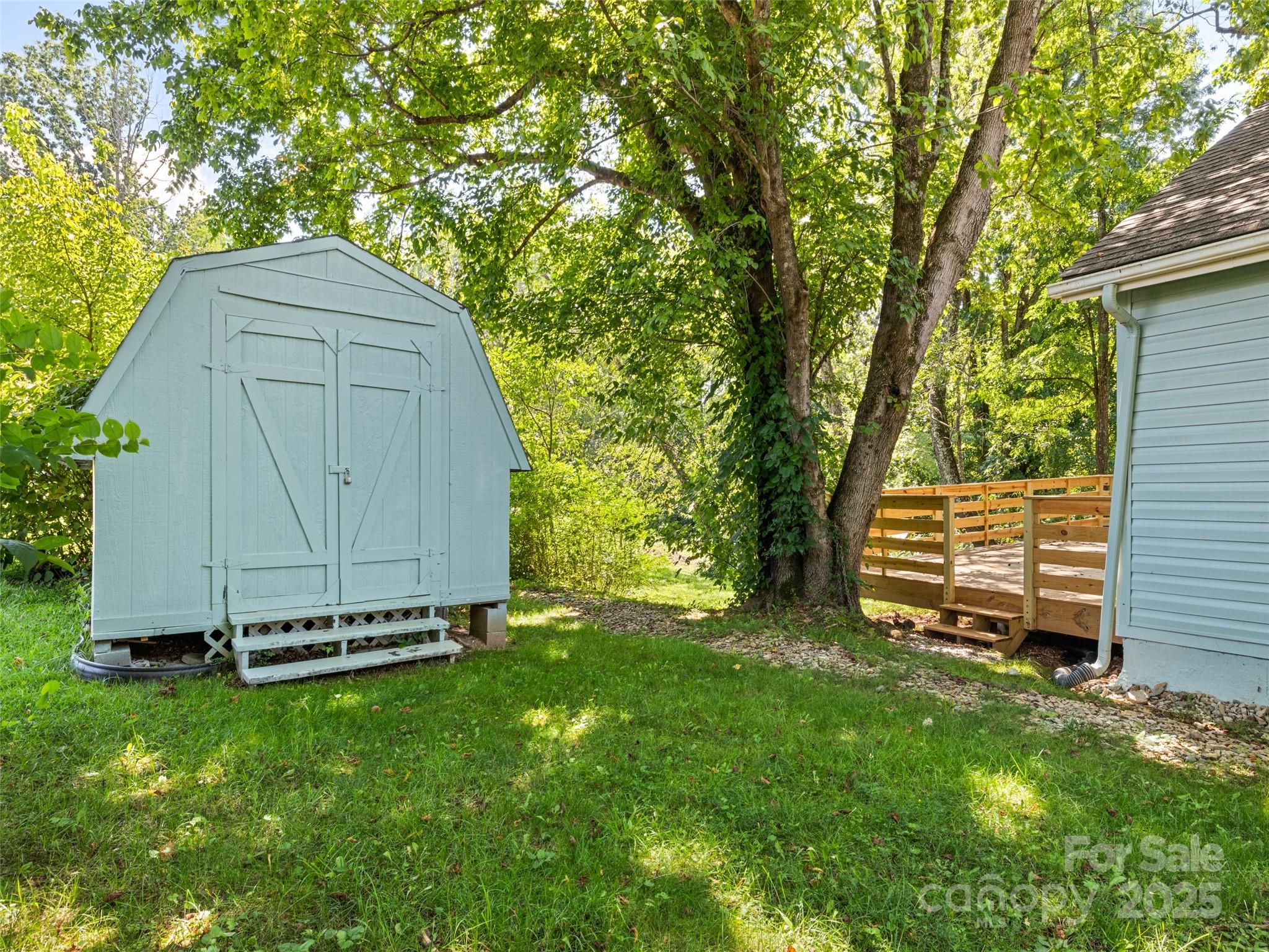 468 Deaverview Road Asheville, NC 28806 - Photo 6 of 26 a view of a backyard with a small cabin