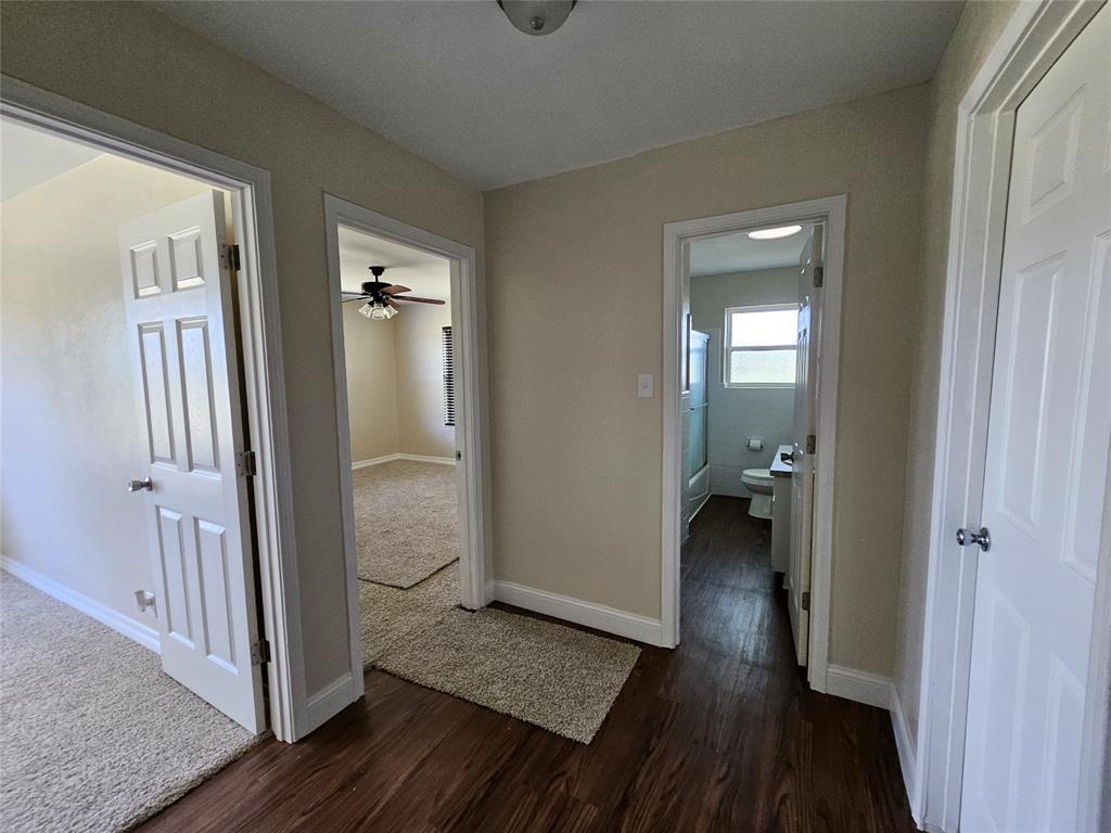 2100 Farm To Market 4 Cleburne, TX 76031 - Photo 9 of 16 a view of a room with wooden floor and a bathroom