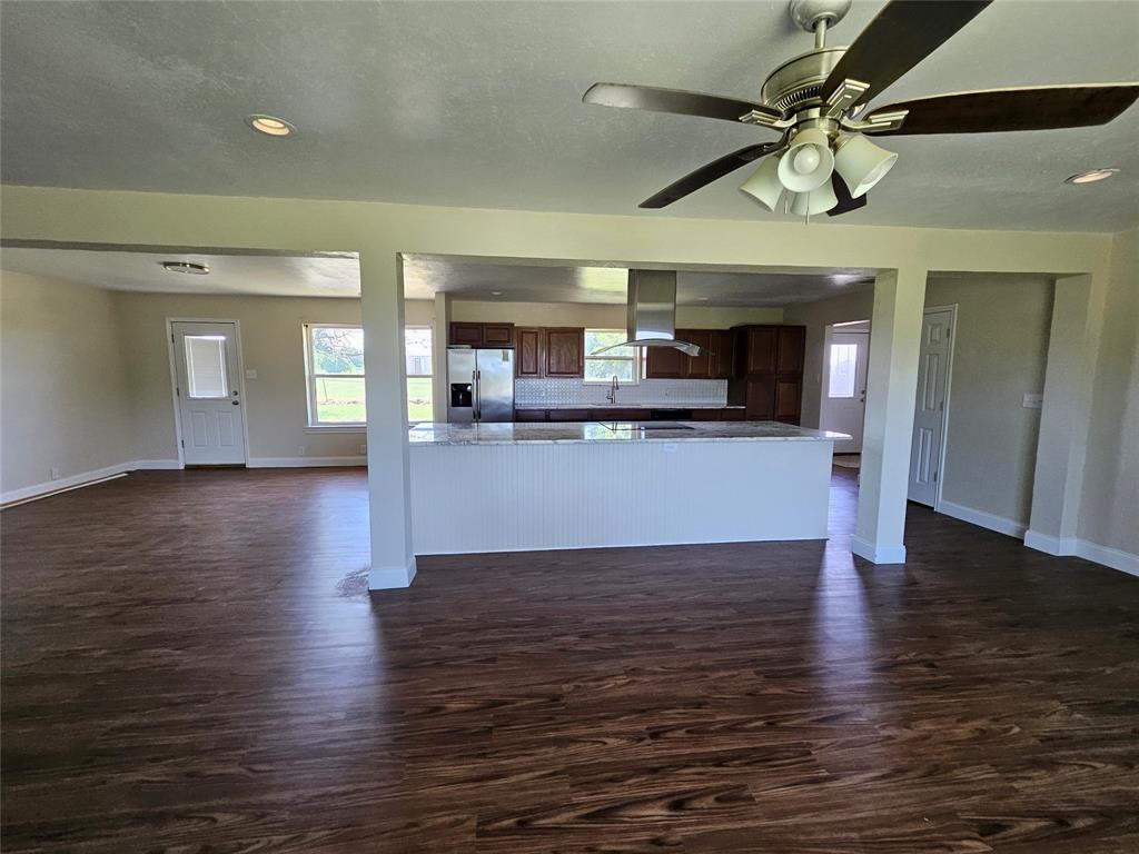 2100 Farm To Market 4 Cleburne, TX 76031 - Photo 16 of 16 a view of a kitchen with a stove cabinets and wooden floor