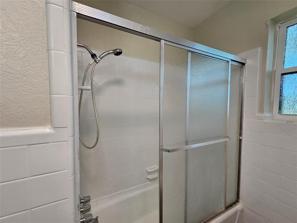 2100 Farm To Market 4 Cleburne, TX 76031 - Photo 12 of 16 a bathroom with a glass shower door