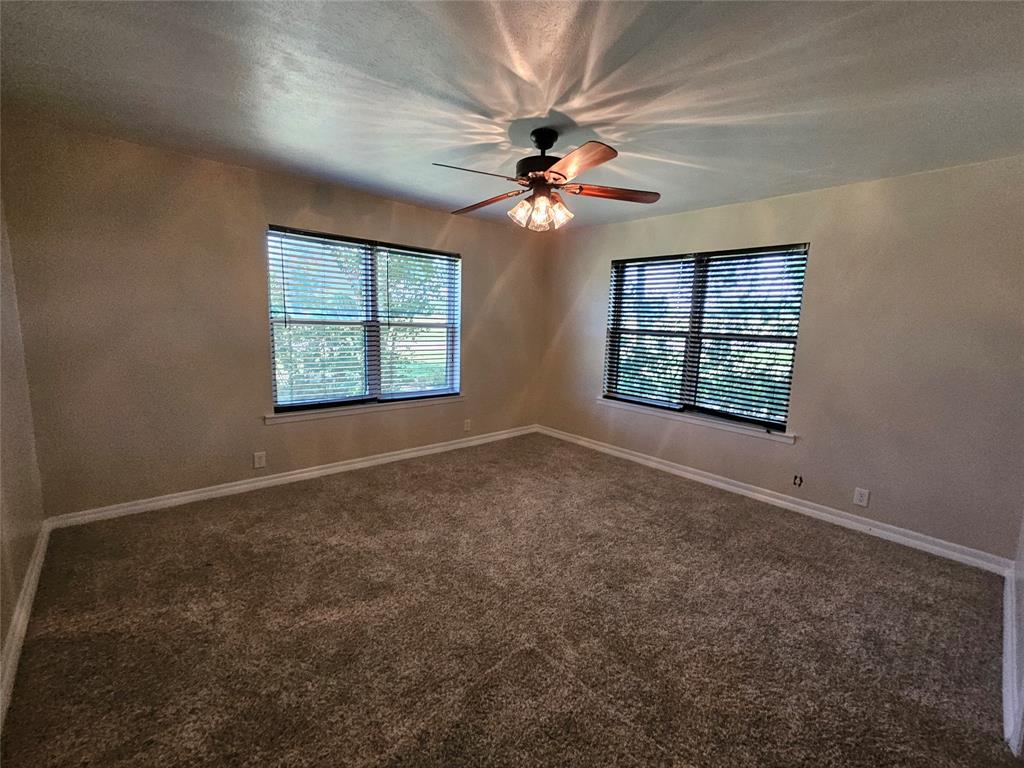2100 Farm To Market 4 Cleburne, TX 76031 - Photo 4 of 16 an empty room with windows and fan
