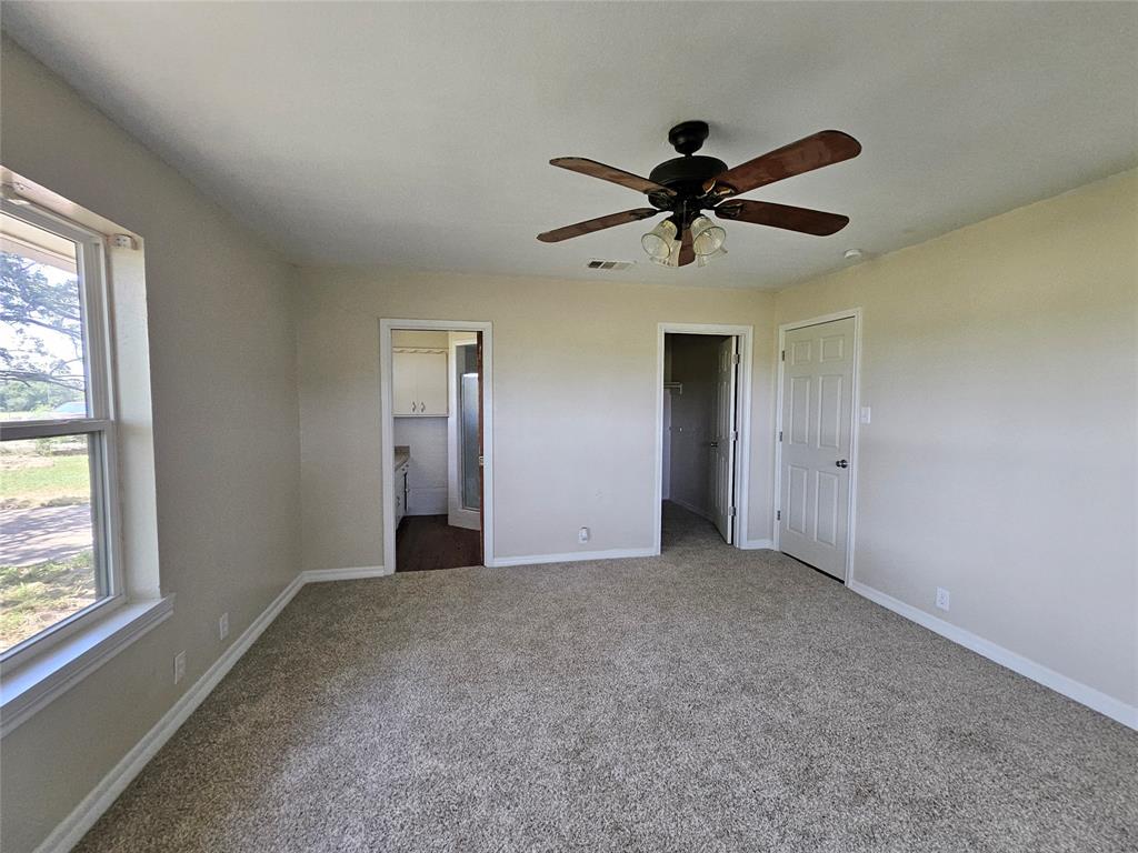 2100 Farm To Market 4 Cleburne, TX 76031 - Photo 6 of 16 a view of a livingroom with a ceiling fan and window