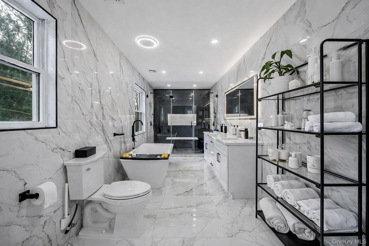 68 Fort Salonga Road Northport, NY 11768 - Photo 29 of 50 a bathroom with a toilet sink and mirror