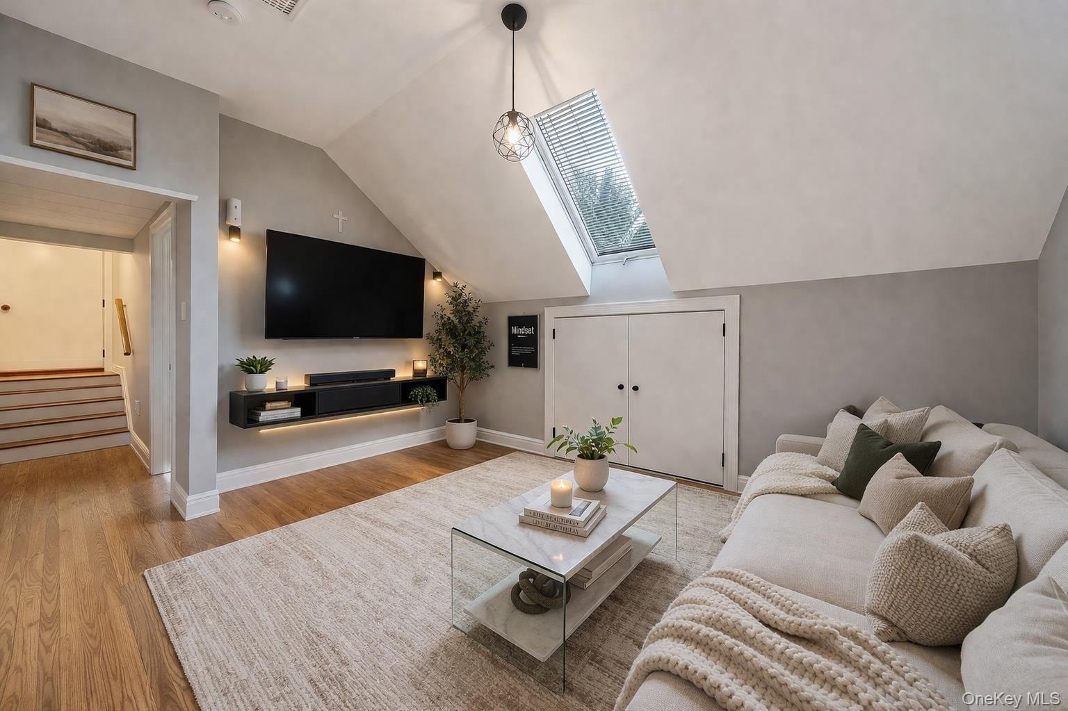 68 Fort Salonga Road Northport, NY 11768 - Photo 33 of 50 a living room with furniture and a flat screen tv